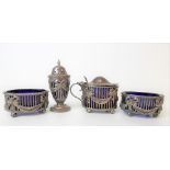 Victorian silver four piece cruet set, the sides pierced and embossed with ribbon bow swags,