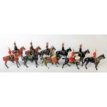 W. Britain collection of seven Irish Hussars, one playing drums & three Dragoon figures, two with