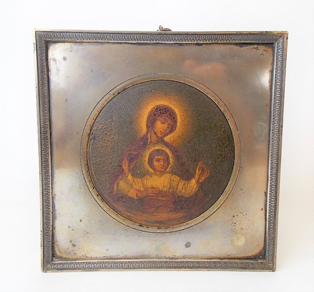 Late 19th Century/early 20th Century Russian silver square frame with circular aperture, enclosing