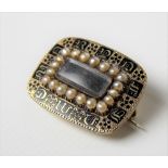 19th Century gold and black enamel seed pearl set mourning rectangular brooch with glazed hair panel