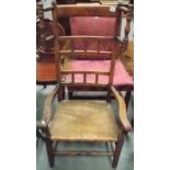 A Lancashire rush seat ladderback elbow chair with bobbin turned side head rails