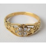 18ct hallmarked gold diamond four stone ring, the collet set diamonds of 0.04ct spread approx, the