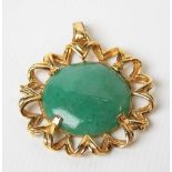 Yellow metal mounted green jade cabochon pendant, with suspension ring, diameter 30mm, weight 6.4g