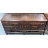 George III oak mule chest, the hinged lid over an arrangement of two dummy cupboards & four dummy