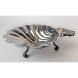 Modern silver scallop shell moulded dish raised on triple scroll feet, maker FH, Sheffield 1971,