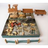 Small toy pine locomotive and two carts; together with carved and painted wood farm animals.