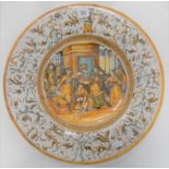 Maiolica 16th Century style charger depicting a Biblical interior scene with decapitated head on a