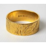 22ct hallmarked gold textured wedding band, diameter 18.25mm approx, weight 7.6g approx.