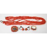 Victorian yellow metal mounted coral set jewellery including a three stone ring, brooch with glass