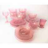 Set of seven Venetian pink lustre glass pedestal dessert bowls and plates; together with a spare