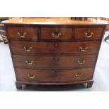 George III mahogany bow front chest of three short over three long graduated drawers upon bracket