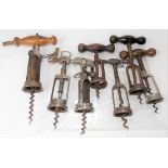 Collection of antique barrel action corkscrews.