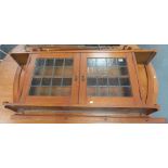 Oak Arts & Crafts wall hanging cabinet with lead glazed hinged doors with frosted glass panels,
