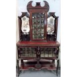 Good Edwardian walnut display cabinet, the raised back with convex astragal glazed door flanked by