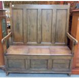 19th Century stained pine bench seat settle, the four panel back over a hinged box seat with three