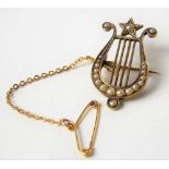 18ct gold (untested) seed pearl set lyre brooch, weight 3.4g approx.