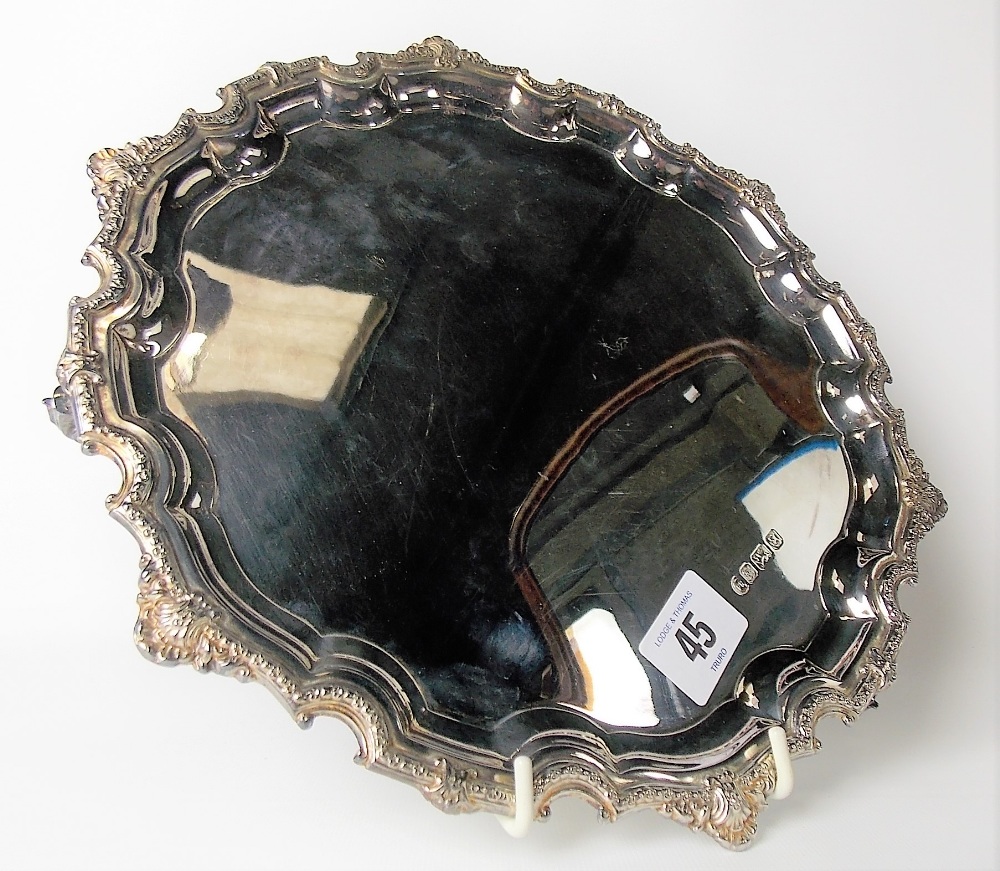 Modern silver salver with foliate shell cast piecrust rim raised on triple shell cast feet, maker