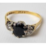 18ct hallmarked gold diamond & sapphire three stone ring, the illusion set diamonds of 0.05ct spread