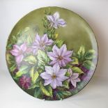Large early 20th Century porcelain charger painted with flowers, the back signed J Lee, diameter