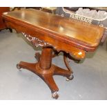 19th Century rosewood pedestal card table, the hinged swivel top with circular baize inset over a