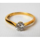 Modern 18ct gold and platinum set diamond solitaire ring, the brilliant cut diamond of 0.30ct spread
