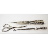 Victorian silver embossed weighted handle glove stretcher; together with a silver handled buttonhook