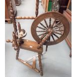 Antique oak spinning wheel with ring turned bobbin spindles, height overall 104cm