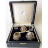 Japanese sterling silver three piece cased cruet in the form of ring handled garden seats,