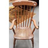 A Windsor chair with comb back & yew seat
