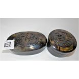 Two Chinese tortoiseshell oval and circular lidded boxes, the lids applied with coiled dragons,