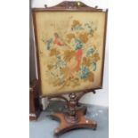 19th Century rosewood pedestal fire screen, the rectangular frame with scroll carved top, with a