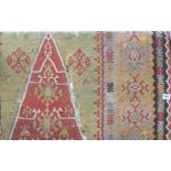 Antique Kelim rug with central lozenge and within geometric multiple borders (AF).