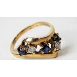 9ct hallmarked gold diamond and sapphire five stone cross over ring, the two diamonds of 0.07ct