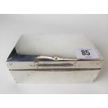 A silver hallmarked hinge-lidded cigarette box