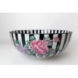 Chinese famille noir bowl, painted in enamels with chrysanthemum upon a black striped glaze,