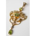 Attractive 15ct gold seed pearl & peridot set pendant, of openwork design set with two collet set