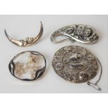 Four silver hallmarked brooches, including a Celtic annular brooch cast with rose amongst knots