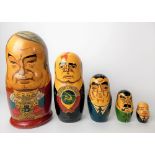 Set of four graduated 20th Century Russian dolls painted as Kremlin politicians.