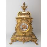 19th Century French Ormolu two train mantel clock, the architectural case with foliate scrolls and