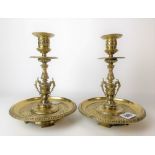 Pair of 19th Century brass foliate cast candlesticks with circular drip trays, height 19cm.