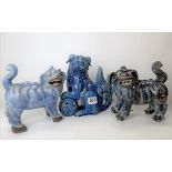 Chinese blue glazed pottery lion, his left front paw resting on a pierced ball, height 19cm;