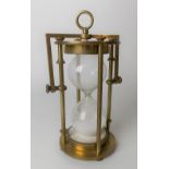 Brass gimballed twenty minute sand timer, height 14cm.