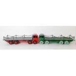 Two Dinky Supertoys diecast Foden flat trucks with chains, one in red and grey, the other green (2).