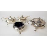 Pair of George V hinge lidded mustard pots by Walker & Hall, with blue glass liners and raised on