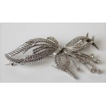 Attractive white metal, possibly platinum, diamond set floral spray openwork brooch set with