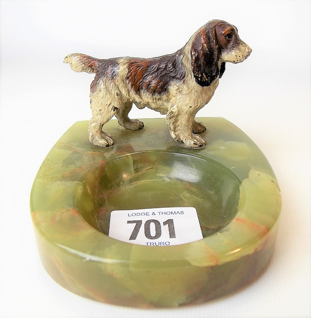 Australian cold painted bronze spaniel applied to a green onyx ashtray, length of dog 8cm.