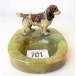 Australian cold painted bronze spaniel applied to a green onyx ashtray, length of dog 8cm.