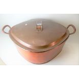 Large copper twin handled lidded preserve pan with twin iron handles, of lozenge shape, width 63cm