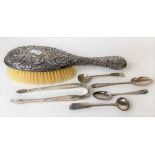 George III bright cut pair of sugar nips; together with four various George III silver spoons and