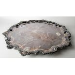 Impressive modern silver salver, with foliate shell cast piecrust border and raised on triple